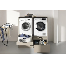 Meuble de buanderie moderne beige pour lave-linge et sèche-linge, équipé de tiroirs et tablettes coulissantes pratiques.