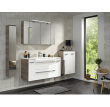 Ensemble de meubles de salle de bains avec meuble sous vasque blanc, armoire de toilette et colonne aspect bois et blanc.