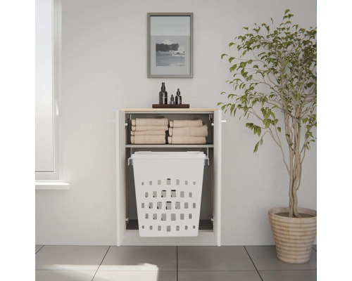 Meuble à linge mural blanc avec panier à linge intégré et étagère pour serviettes dans une salle de bain moderne.