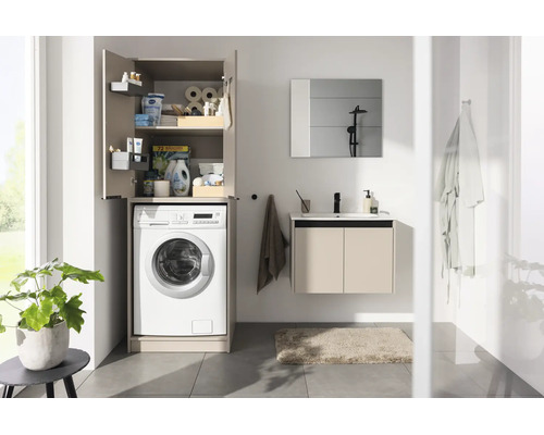Salle de bain moderne avec meuble pour lave-linge, meuble sous-vasque, miroir et carrelage.