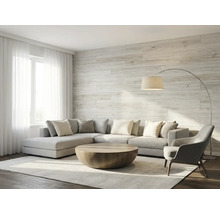 Panneaux muraux aspect bois dans un salon moderne et lumineux avec canapé d'angle et table basse ronde.