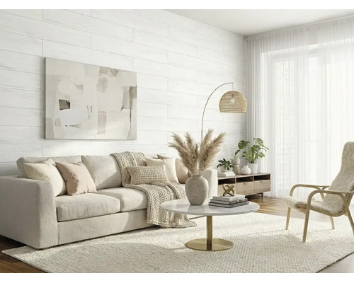 Salon moderne et lumineux avec panneaux muraux blancs aspect bois, canapé beige, table basse ronde en marbre et lampadaire à abat-jour tressé.