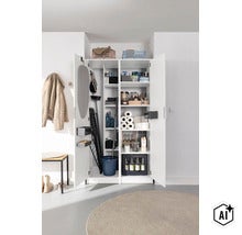 Armoire à balais ouverte avec planche à repasser, séchoir, seau, produits de nettoyage et provisions. (Image AI modified or generated)