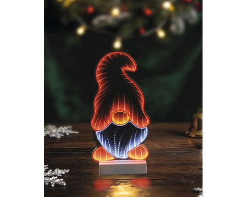 Décoration de Noël LED avec miroir d'infinité en forme de gnome avec éclairage orange et blanc sur une table en bois.