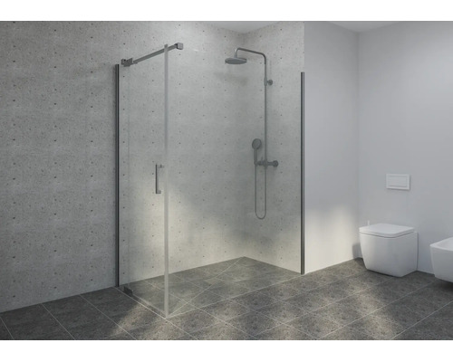 Moderne Duschkabine aus Glas mit verchromten Armaturen, hellgrauen Wandfliesen und dunkelgrauen Bodenfliesen in einem hellen Badezimmer.
