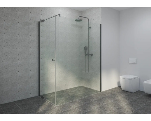 Douche à l'italienne moderne avec paroi en verre, colonne de douche et WC suspendu dans une salle de bains lumineuse avec carrelage aspect béton.