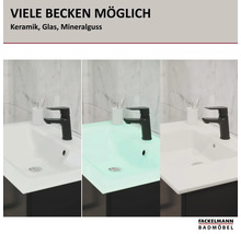 Lavabos Fackelmann Badmöbel en céramique, verre et fonte minérale avec robinetterie sur meuble sous-vasque devant mur en marbre. Logo Fackelmann.