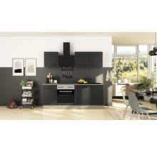 Cuisine intégrée moderne anthracite avec appareils électroménagers, évier et meubles hauts dans une pièce lumineuse.