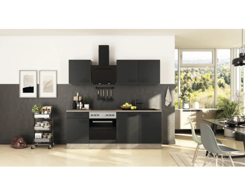 Cuisine intégrée moderne anthracite avec appareils électroménagers, évier et meubles hauts dans une pièce lumineuse.
