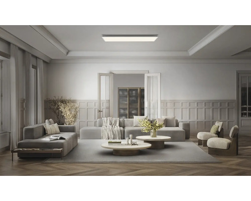 Rechteckiges LED-Deckenpanel in einem modernen, geräumigen Wohnzimmer mit Sitzgruppe und Wandpaneelen.