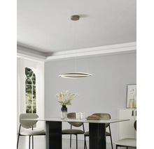 Suspension LED moderne en forme d anneau au-dessus d une table à manger en marbre dans une salle à manger lumineuse et minimaliste.