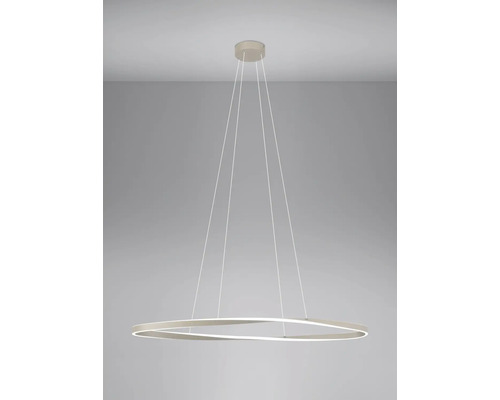 Suspension LED moderne avec un anneau ondulé et de fins câbles de suspension.