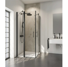 Cabine de douche d'angle moderne avec cadre noir et système de douche dans une salle de bains lumineuse et contemporaine avec lavabo et miroir.