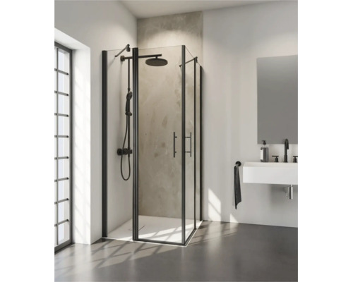 Cabine de douche d'angle moderne avec cadre noir et système de douche dans une salle de bains lumineuse et contemporaine avec lavabo et miroir.