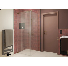 Douche d'angle moderne avec porte vitrée et système de douche devant un mur carrelé dans une salle de bain