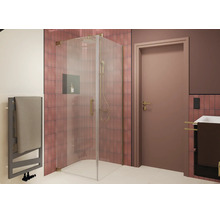 Douche dangle moderne avec porte en verre et robinetterie métallique dans une salle de bain carrelée avec sèche serviettes et lavabo