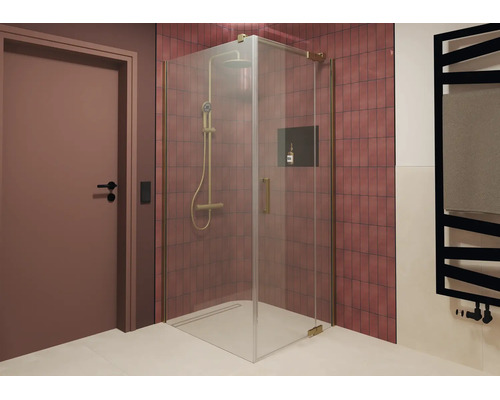 Douche d angle moderne avec éléments en verre et système de douche dans une salle de bain avec mur carrelé et niche intégrée.