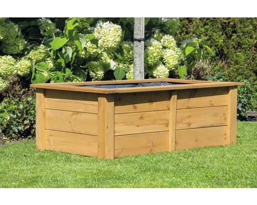 Jardinière surélevée en bois dans le jardin