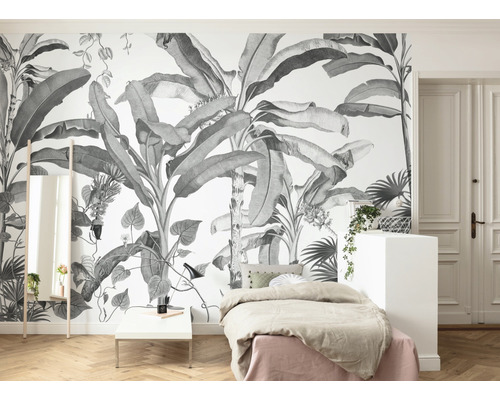 Chambre à coucher avec papier peint photo tropical, lit et miroir