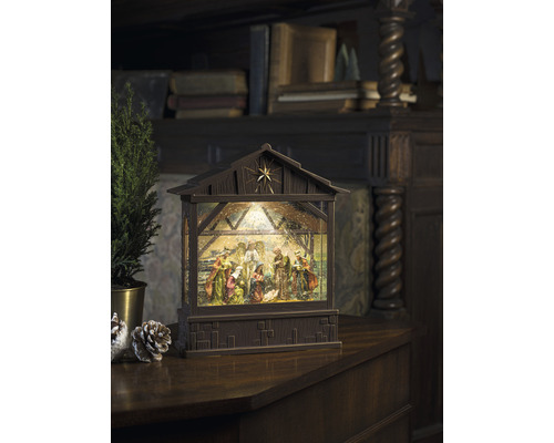 Crèche de Noël décorative avec éclairage et scène traditionnelle.