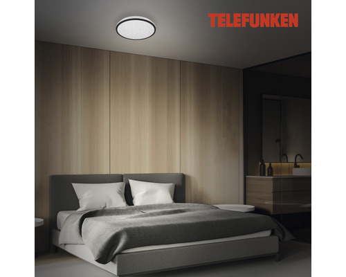 Schlafzimmer mit Deckenleuchte und Telefunken Logo