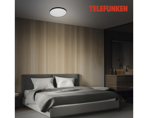 Chambre à coucher avec plafonnier et logo Telefunken