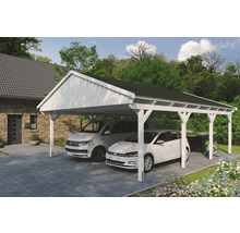 Double carport en bois avec deux voitures garées dans une cour pavée.