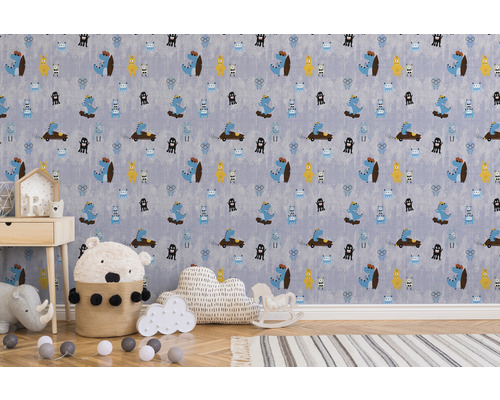 Kindertapete mit Dinosaurier- und Monster-Motiven in einem hellen Kinderzimmer.