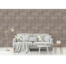 Wohnzimmer mit Sofa, Tisch und Steinoptik Tapete