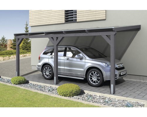 Carport mit Auto auf gepflasterter Einfahrt