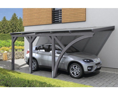 Voiture sous un abri de voiture en bois