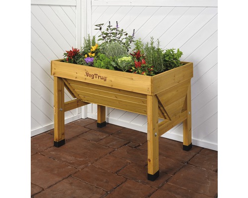 Jardinière sur pieds en bois avec des plantes