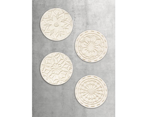Vier runde Wanddekorationsstücke mit floralen Mustern