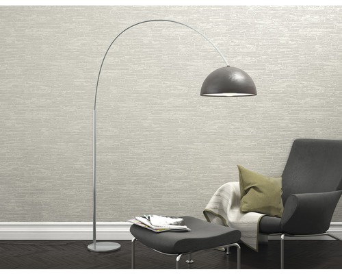 Coin lecture avec lampadaire arqué, fauteuil et repose-pieds