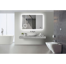Salle de bains moderne avec miroir lumineux, lavabo, baignoire et bidet