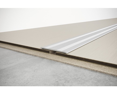 Profilé de sol pour raccorder différents revêtements de sol