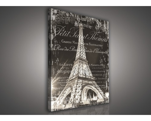 Leinwandbild mit dem Eiffelturm und Schriftzügen im Vintage Stil