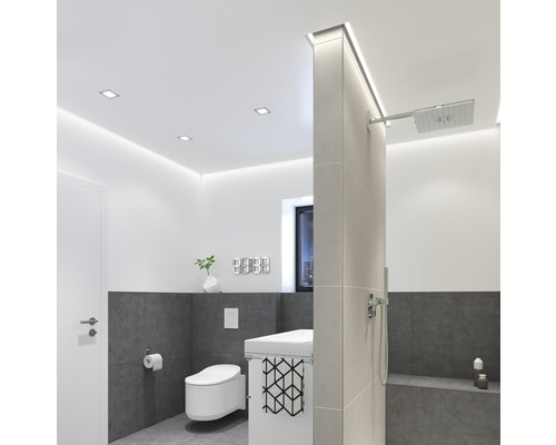 Salle de bain moderne avec toilettes, lavabo et douche