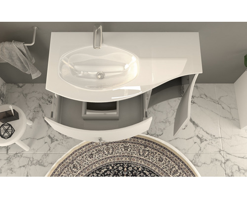 Salle de bains avec lavabo, meuble bas ouvert et tapis rond