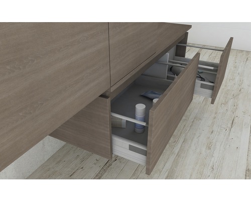 Meuble sous-lavabo avec tiroirs ouverts pour le rangement de la salle de bains