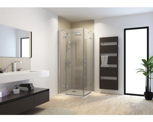 Salle de bain moderne avec cabine de douche, lavabo et sèche-serviettes
