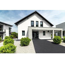 Maison d''habitation moderne avec allée pavée et jardin