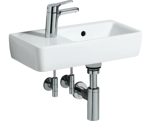 Waschbecken mit Armatur und Siphon