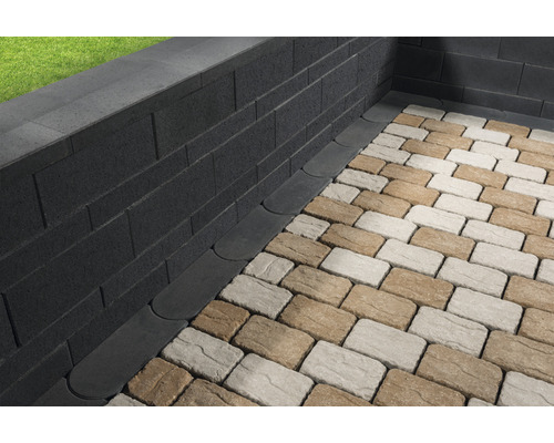 Mur de jardin avec pavés et caniveau de drainage