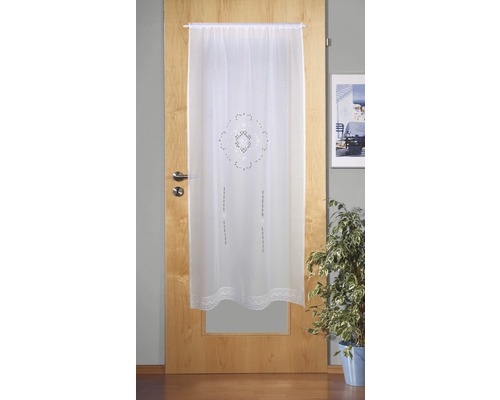 Weiße Türgardine mit Muster und Spitze vor einer Holztür
