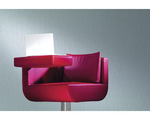 Fauteuil rouge avec table intégrée et ordinateur portable