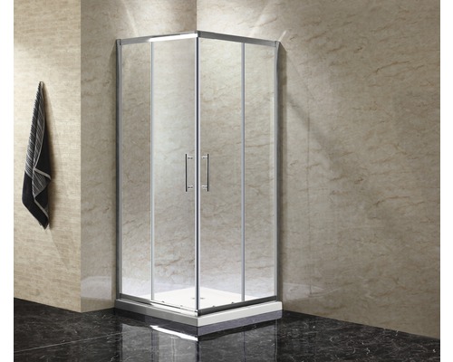 Cabine de douche d''angle avec portes en verre clair et cadre argenté dans la salle de bain