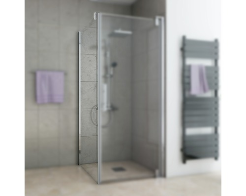 Douche avec porte tournante en verre et métal dans une salle de bain