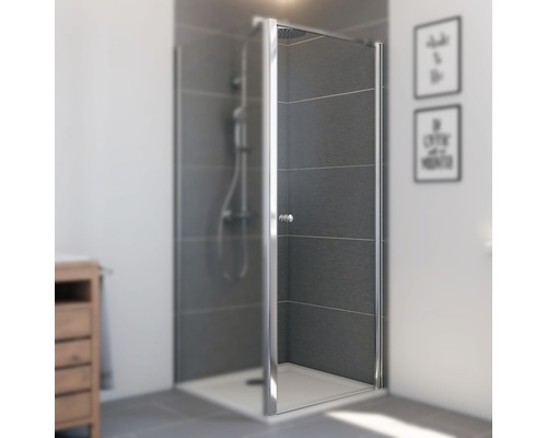 Douche avec paroi de douche en verre et cadre argenté dans une salle de bains.