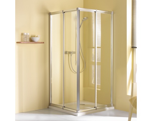 Cabine de douche d''angle avec portes en verre et robinetterie dans une salle de bains